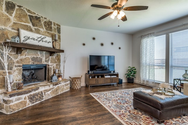 1839 Tuscany Dr, Mclendon Chisholm, TX 75032 - living area featuring a ceiling fan, wood finished floors, a fireplace, and baseboards