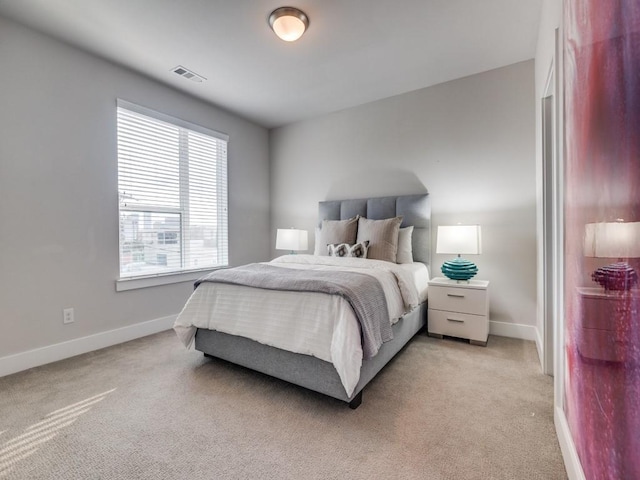 1129 Manderly Ct, Dallas, TX 75204 - bedroom featuring baseboards and light carpet