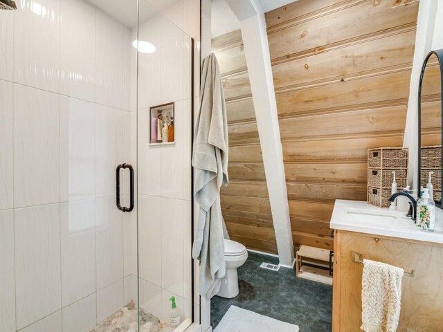 467 Old Mill Ln, East Tawakoni, TX 75472 - full bathroom with vanity, a shower stall, wood walls, and toilet