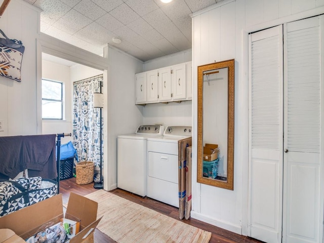 467 Old Mill Ln, East Tawakoni, TX 75472 - laundry room with washing machine and clothes dryer, dark wood-type flooring, and cabinet space