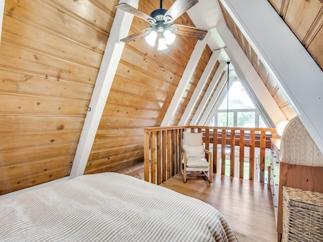 467 Old Mill Ln, East Tawakoni, TX 75472 - bedroom with wood walls, vaulted ceiling, and wood finished floors