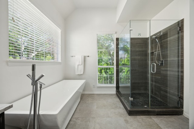 2805 Bitterroot Ct, Plano, TX 75025 - bathroom with a shower stall, a freestanding bath, and vaulted ceiling
