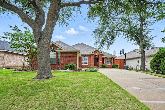 4416 Heath Ct, Plano, TX 75024 - view of front of property featuring brick siding, a front yard, and concrete driveway