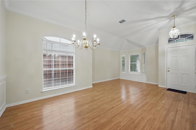 4416 Heath Ct, Plano, TX 75024 - unfurnished dining area with a chandelier, light wood-style floors, baseboards, ornamental molding, and vaulted ceiling