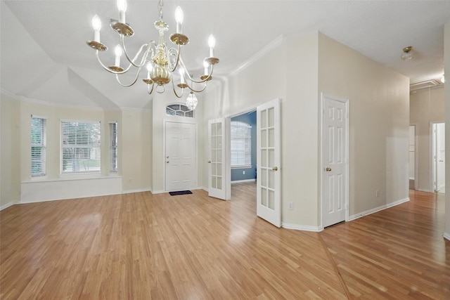 4416 Heath Ct, Plano, TX 75024 - foyer entrance with ornamental molding, healthy amount of natural light, light wood-style floors, and a chandelier