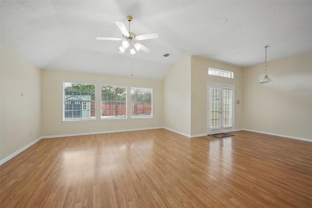 4416 Heath Ct, Plano, TX 75024 - unfurnished living room with plenty of natural light, light wood finished floors, lofted ceiling, ceiling fan, and baseboards