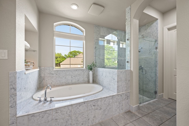 1665 Florence Rd, Keller, TX 76262 - bathroom featuring a garden tub, a stall shower, and tile patterned flooring