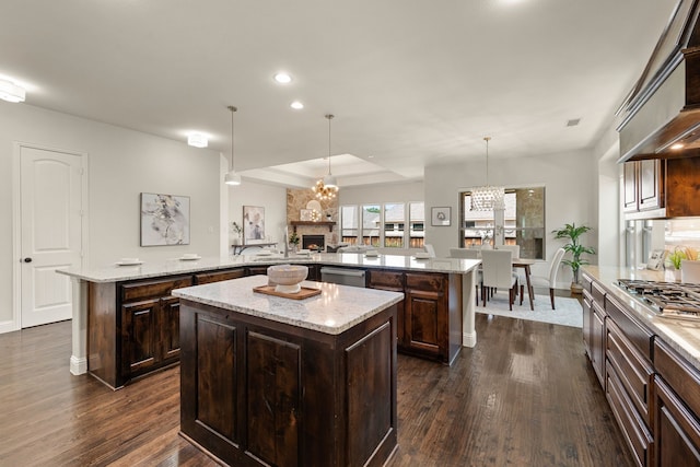 7020 Benjamin Way, Colleyville, TX 76034 - kitchen with a large island, dark wood-style floors, a chandelier, appliances with stainless steel finishes, and recessed lighting