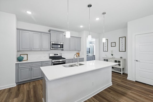 1837 Sebright Trl, Fort Worth, TX 76052 - kitchen with gray cabinetry, appliances with stainless steel finishes, a sink, tasteful backsplash, and recessed lighting