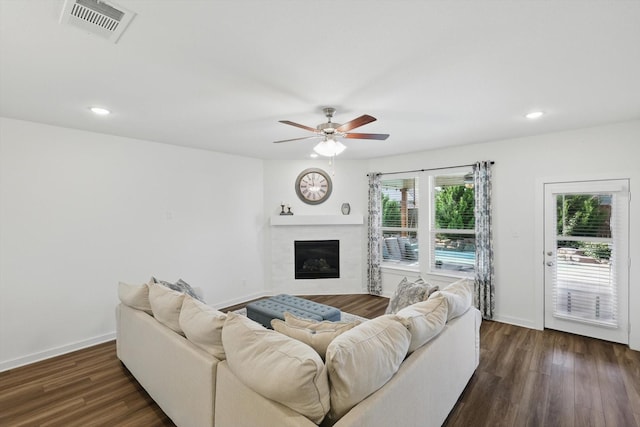 1837 Sebright Trl, Fort Worth, TX 76052 - living room with a glass covered fireplace, a ceiling fan, dark wood-type flooring, baseboards, and recessed lighting