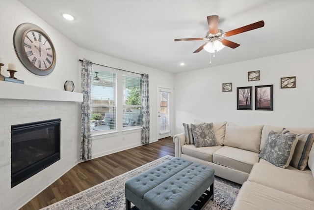 1837 Sebright Trl, Fort Worth, TX 76052 - living area with wood finished floors, a ceiling fan, recessed lighting, a brick fireplace, and baseboards