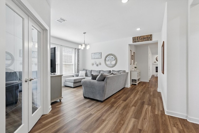 1837 Sebright Trl, Fort Worth, TX 76052 - living room with dark wood finished floors, a chandelier, recessed lighting, and baseboards