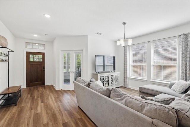 1837 Sebright Trl, Fort Worth, TX 76052 - living room featuring wood finished floors, french doors, recessed lighting, and baseboards