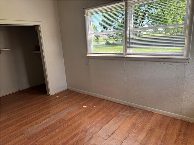 425 S 1st St W, Clyde, TX 79510 - unfurnished bedroom featuring baseboards, light wood-style floors, and a closet
