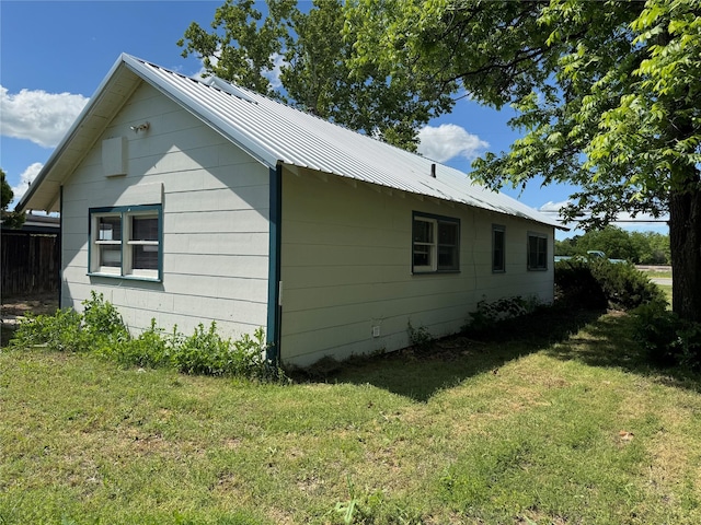 425 S 1st St W, Clyde, TX 79510 - view of side of property with a lawn and metal roof