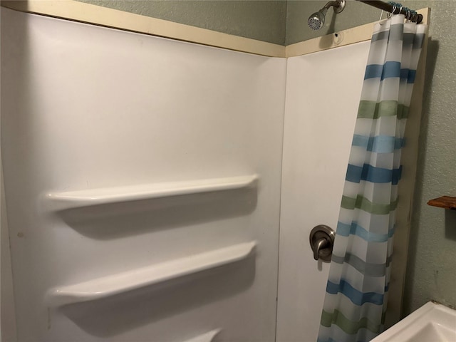 425 S 1st St W, Clyde, TX 79510 - full bathroom with a textured wall and a shower with shower curtain