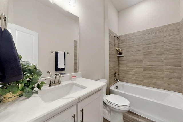 full bathroom with toilet, shower / washtub combination, wood finished floors, and vanity