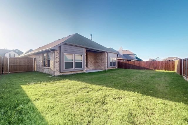 1312 Highcroft Ln, Forney, TX 75126 - rear view of property featuring brick siding and a chimney