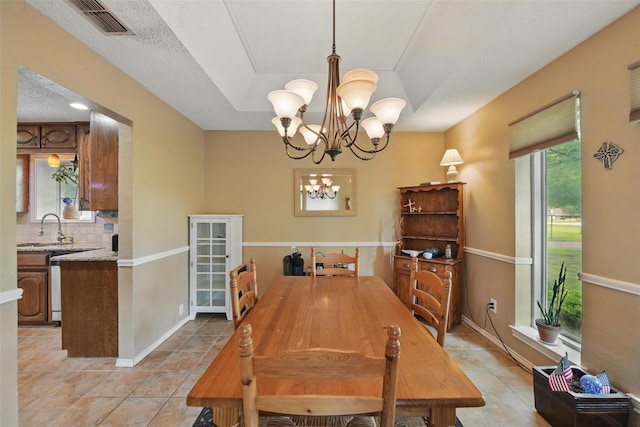 2606 N Carroll Ave, Southlake, TX 76092 - dining area with a chandelier, light tile patterned floors, and baseboards