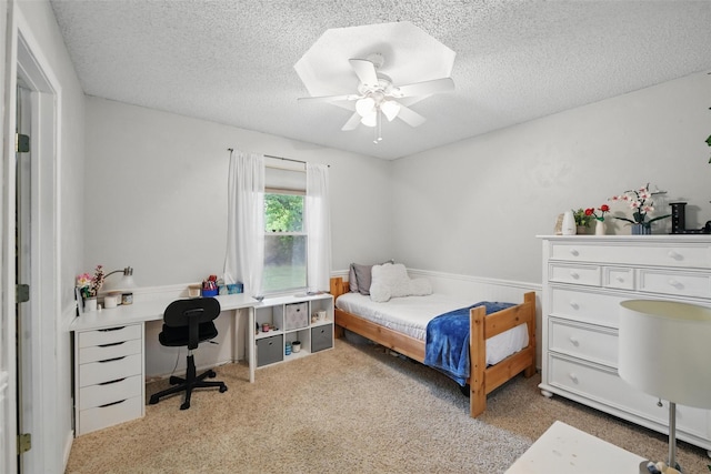 2606 N Carroll Ave, Southlake, TX 76092 - carpeted bedroom featuring a textured ceiling, an office area, and a ceiling fan