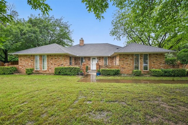 2606 N Carroll Ave, Southlake, TX 76092 - ranch-style home with a chimney, a front lawn, brick siding, and a shingled roof