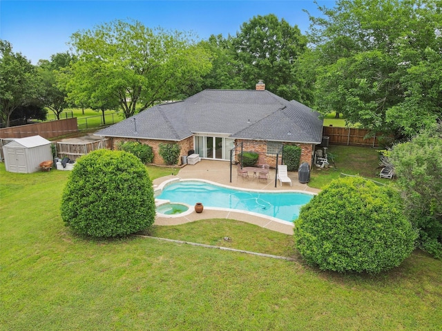 2606 N Carroll Ave, Southlake, TX 76092 - view of swimming pool with a storage unit, a patio, an outdoor structure, a pool with connected hot tub, and view of scattered trees