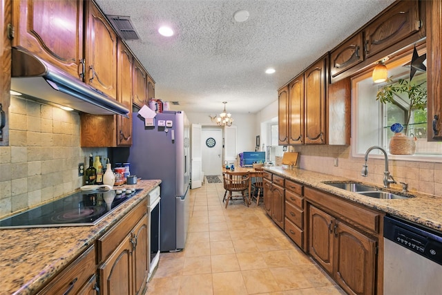 2606 N Carroll Ave, Southlake, TX 76092 - kitchen featuring appliances with stainless steel finishes, a sink, under cabinet range hood, backsplash, and recessed lighting