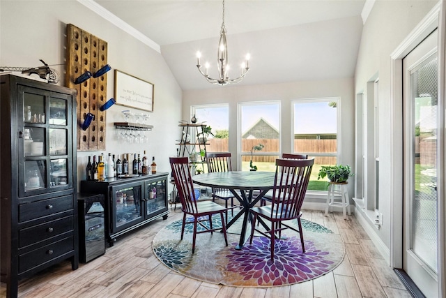 1456 Silent Springs Dr, Fort Worth, TX 76052 - dining space with lofted ceiling, healthy amount of natural light, a bar, a chandelier, and wood finished floors