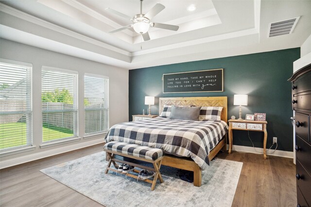 1456 Silent Springs Dr, Fort Worth, TX 76052 - bedroom featuring a raised ceiling, wood finished floors, crown molding, baseboards, and ceiling fan