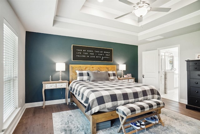 1456 Silent Springs Dr, Fort Worth, TX 76052 - bedroom featuring a tray ceiling, wood finished floors, baseboards, ensuite bathroom, and ceiling fan