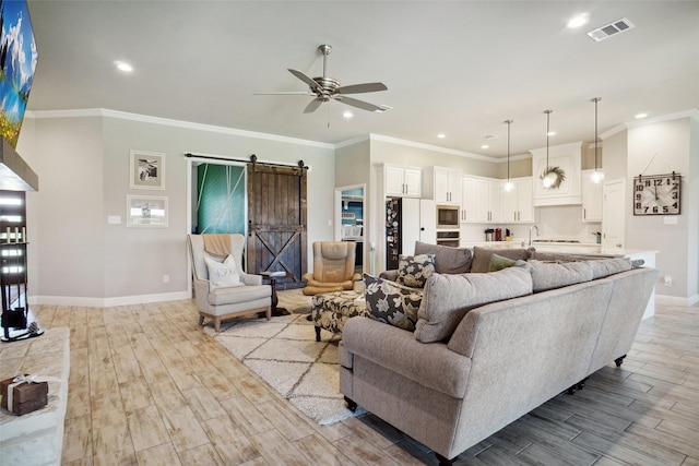 1456 Silent Springs Dr, Fort Worth, TX 76052 - living area featuring a barn door, a ceiling fan, baseboards, recessed lighting, and light wood-style flooring