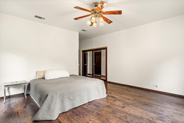 bedroom with wood finished floors, baseboards, and ceiling fan