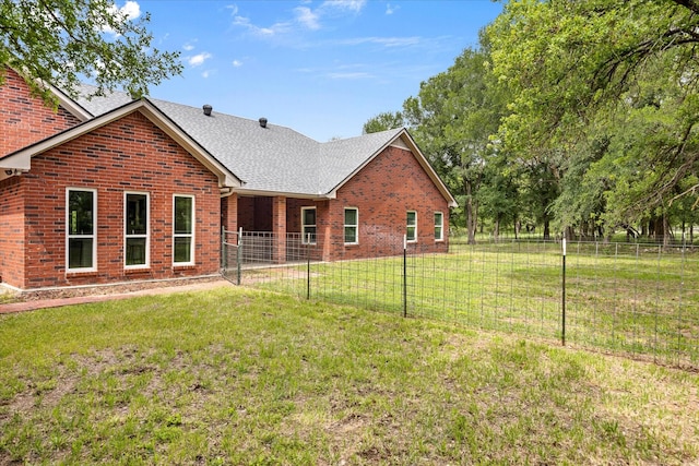 back of house with brick siding and a shingled roof