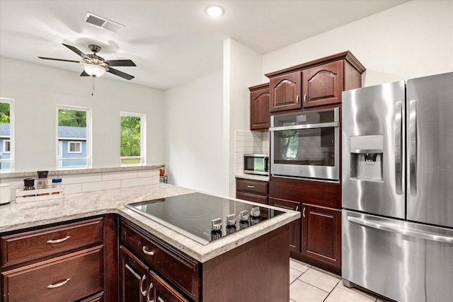 kitchen featuring appliances with stainless steel finishes, ceiling fan, light tile patterned floors, dark brown cabinets, and recessed lighting
