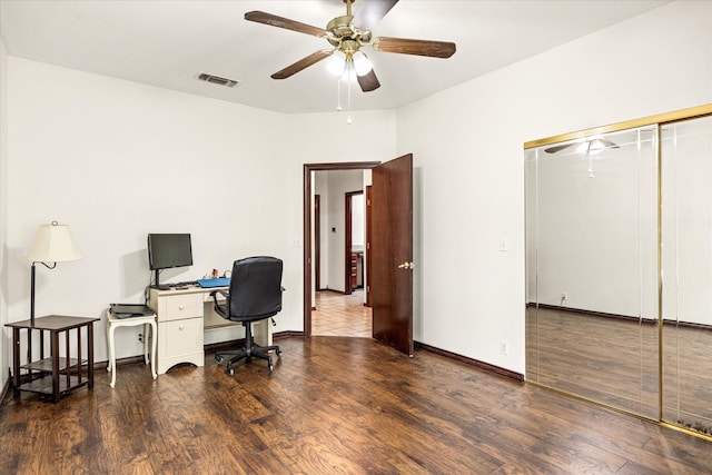 office space featuring wood finished floors, a ceiling fan, and baseboards