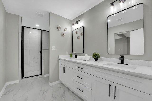 full bathroom featuring marble finish floors, baseboards, a shower stall, and double vanity