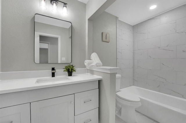 bathroom featuring vanity, toilet, marble finish flooring, and shower / washtub combination