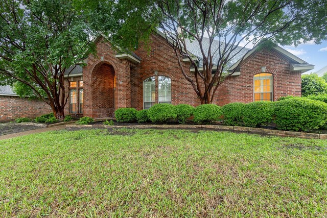 842 Turquoise Pt, Rockwall, TX 75032 - traditional home featuring brick siding and a front lawn