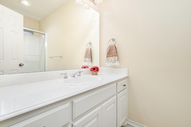 842 Turquoise Pt, Rockwall, TX 75032 - bathroom with vanity, a shower with shower door, and baseboards