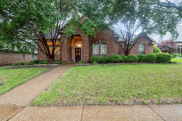 842 Turquoise Pt, Rockwall, TX 75032 - view of front facade featuring brick siding and a front lawn
