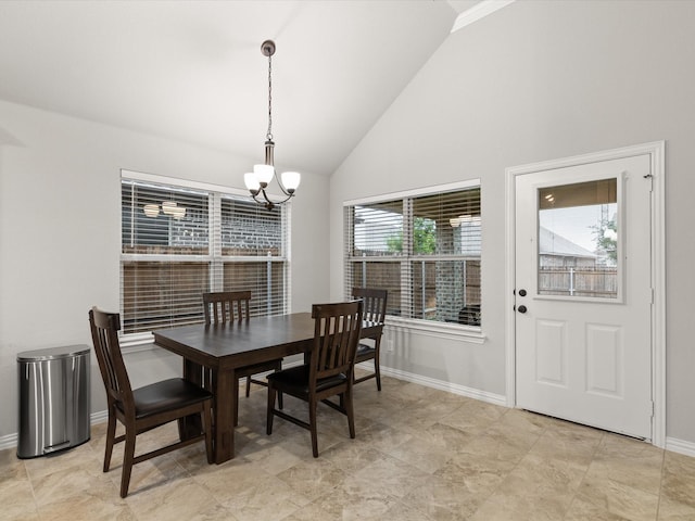 1713 Victoria Dr, Fort Worth, TX 76131 - dining room featuring a chandelier, baseboards, and high vaulted ceiling
