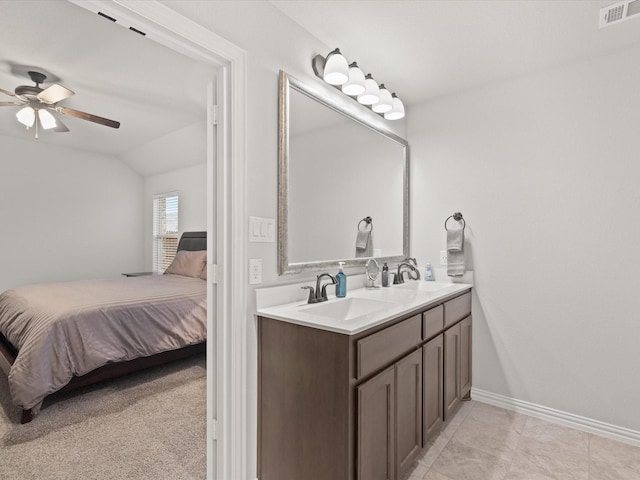 1713 Victoria Dr, Fort Worth, TX 76131 - ensuite bathroom featuring vaulted ceiling, ceiling fan, double vanity, and baseboards