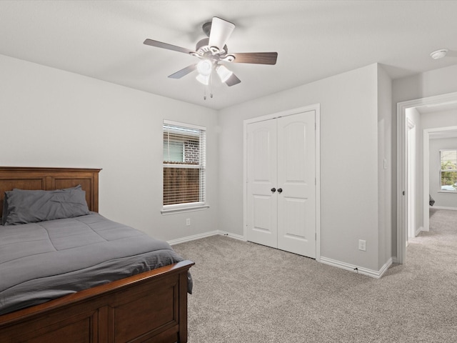1713 Victoria Dr, Fort Worth, TX 76131 - bedroom featuring light colored carpet, baseboards, a closet, and ceiling fan