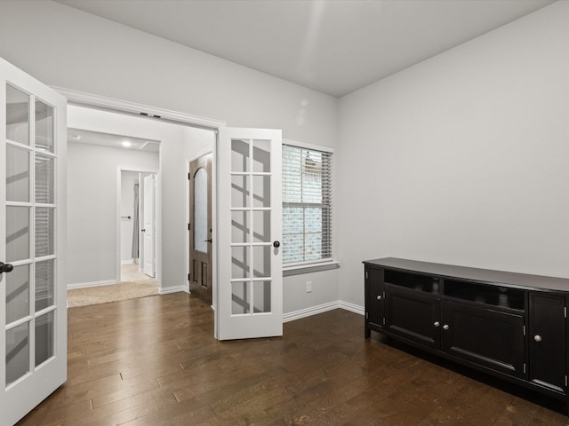 1713 Victoria Dr, Fort Worth, TX 76131 - spare room featuring french doors, dark wood finished floors, and baseboards