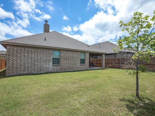 1713 Victoria Dr, Fort Worth, TX 76131 - back of property with brick siding, roof with shingles, and a chimney