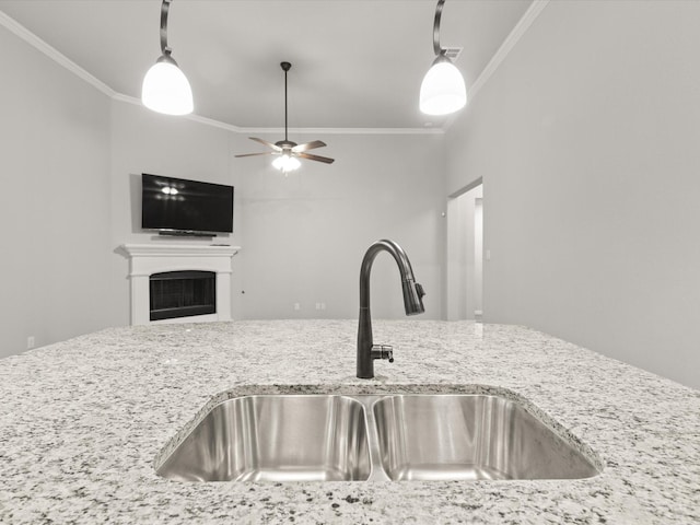 1713 Victoria Dr, Fort Worth, TX 76131 - kitchen with a sink, ornamental molding, light stone countertops, ceiling fan, and decorative light fixtures