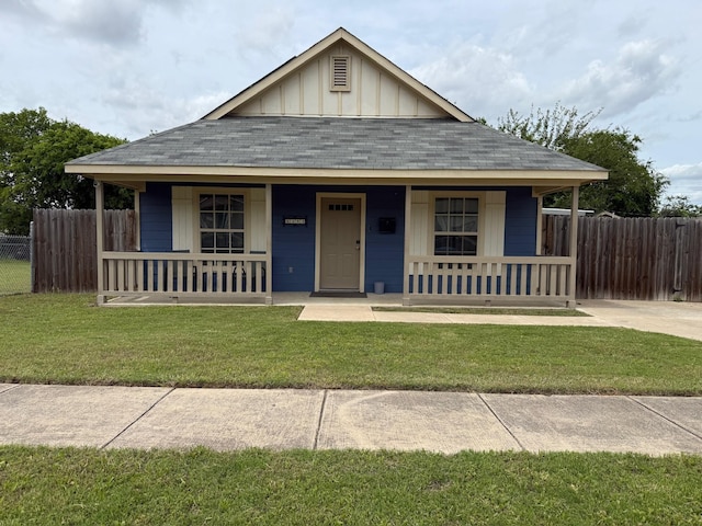 1253 E Ramsey Ave, Fort Worth, TX 76104 - view of front of house featuring a porch, board and batten siding, and a shingled roof