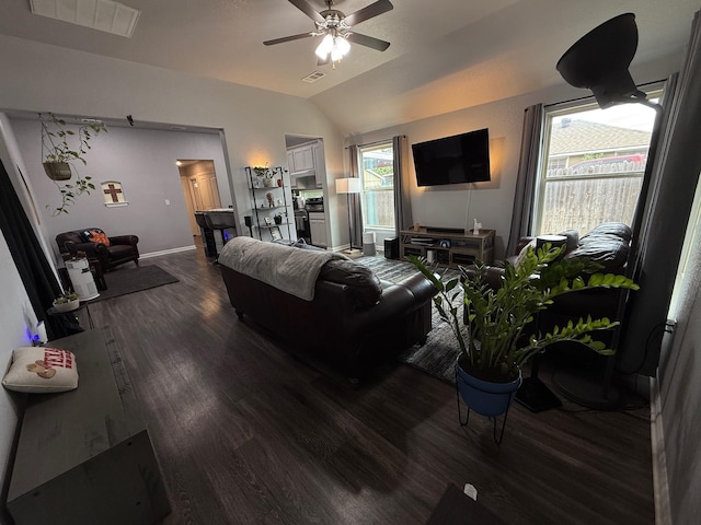 1253 E Ramsey Ave, Fort Worth, TX 76104 - living room featuring wood finished floors, ceiling fan, vaulted ceiling, and baseboards
