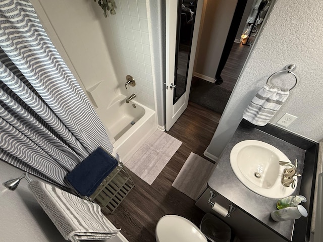 1253 E Ramsey Ave, Fort Worth, TX 76104 - full bathroom featuring shower / bath combination with curtain, wood finished floors, vanity, and toilet