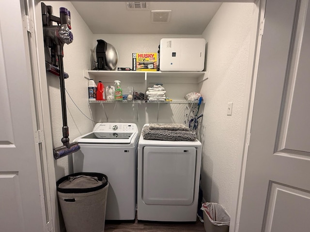 1253 E Ramsey Ave, Fort Worth, TX 76104 - laundry room with independent washer and dryer and dark wood-style flooring